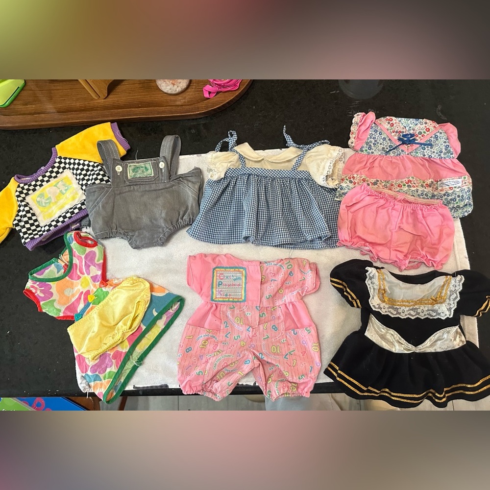 Six Cabbage Patch Kid doll outfits